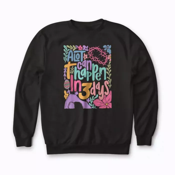 Warmth and hope with the A Lot Can Happen In Three Days Christian Easter sweatshirt.