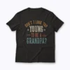 Dont I Look Too Young to Be A Grandpa Fathers day T‑shirt front view