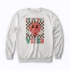 Groovy Christmas Vibes Smile Face Santa sweatshirt with cheerful design